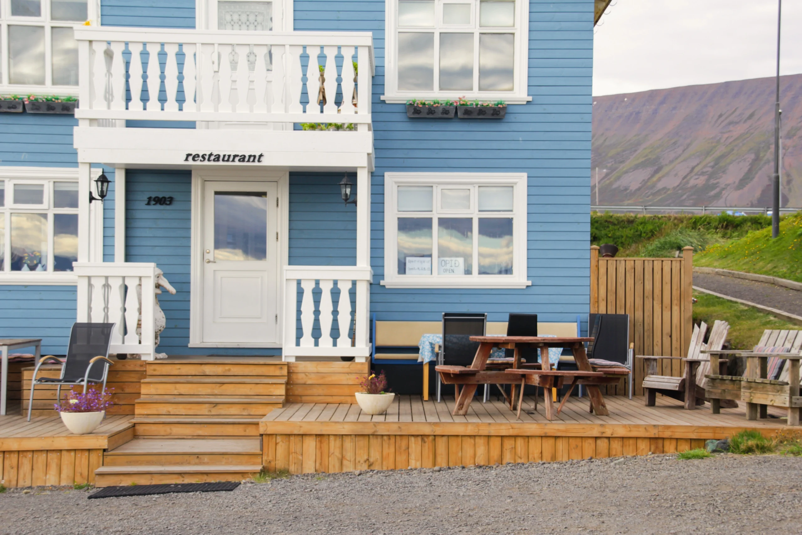 Blue restaurant exterior showing craftsmanship akin to our Siding Installation Covington WA projects.