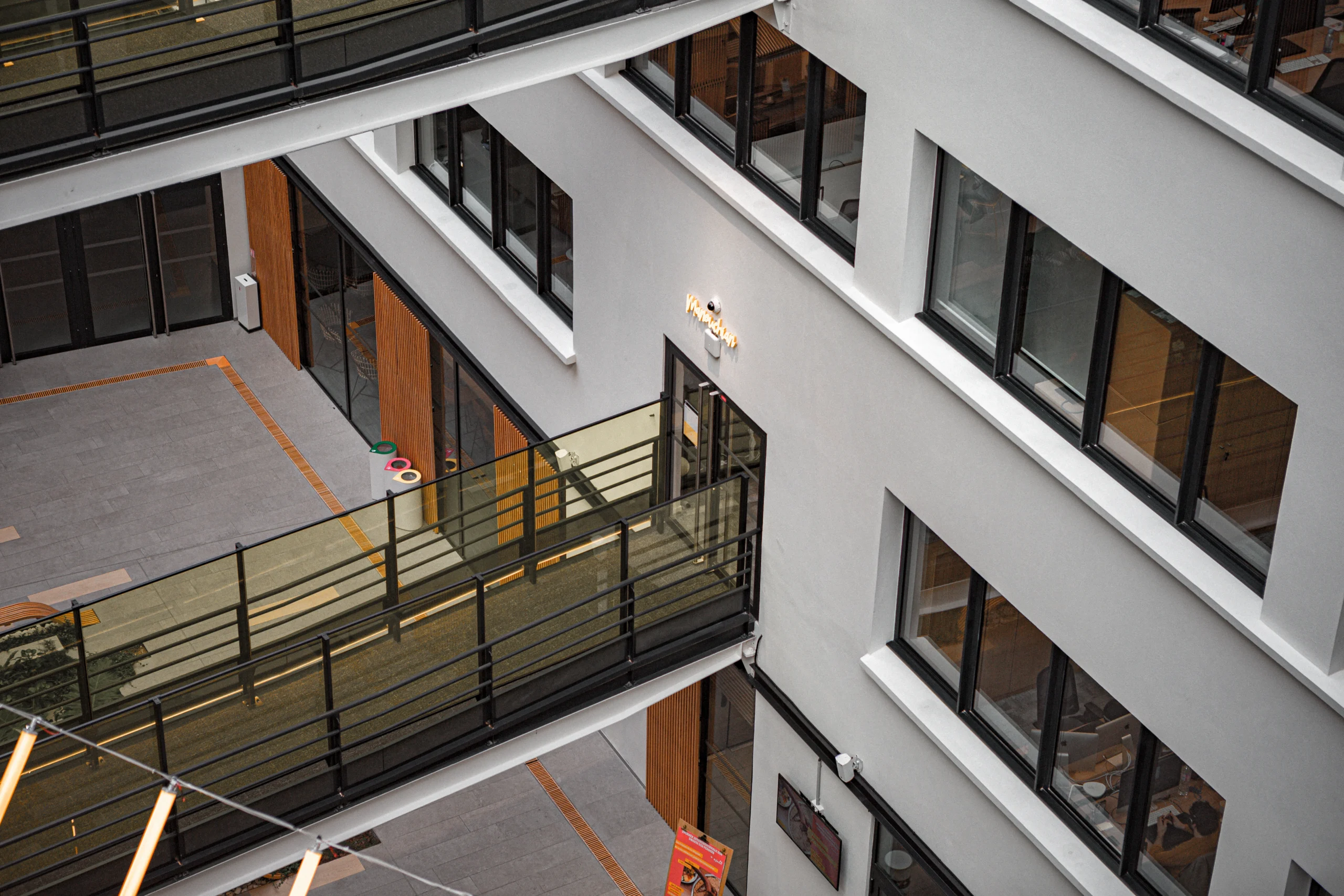 Elevated walkway and modern building exterior constructed by a Commercial Exterior Contractor.