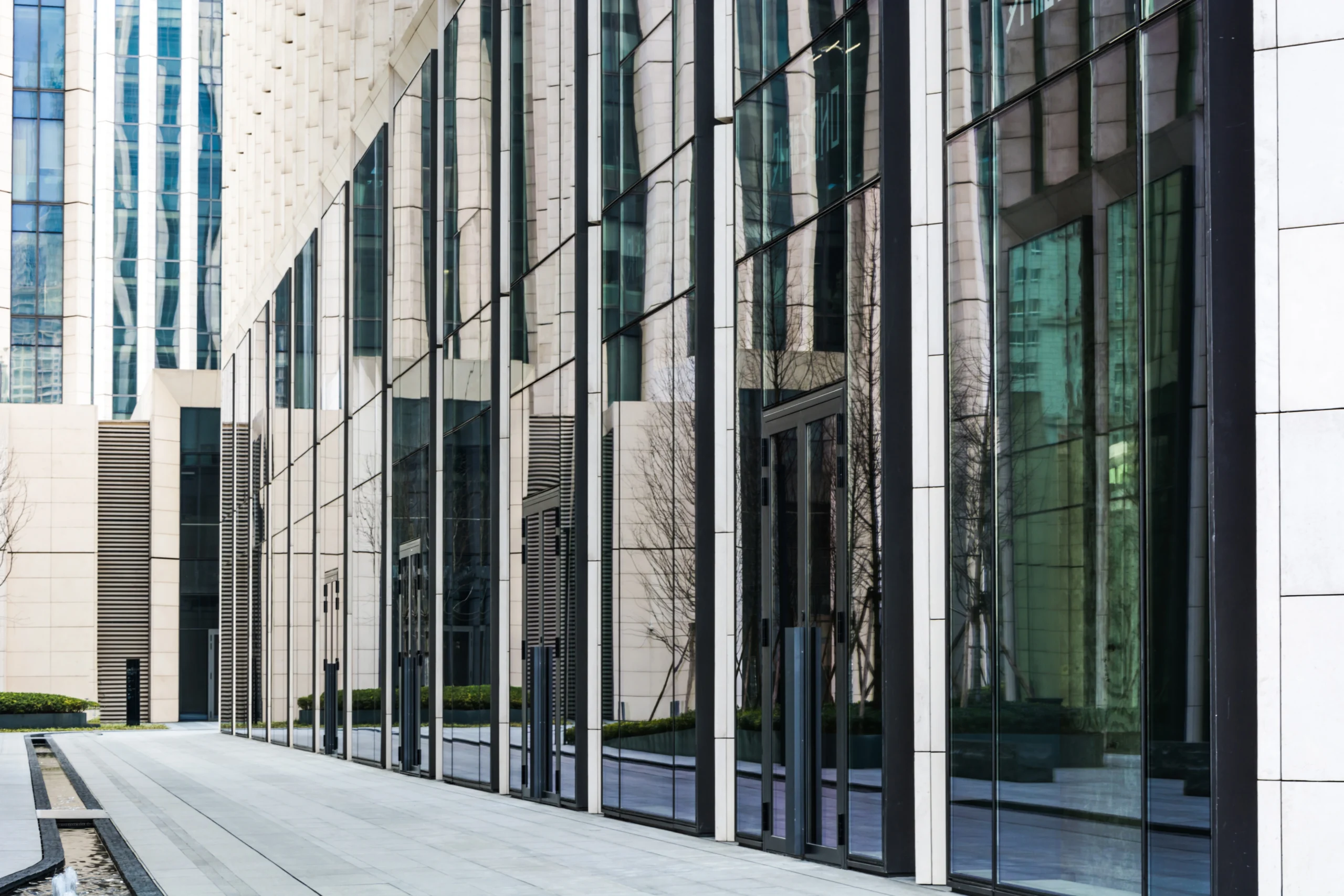 Modern glass curtain wall facade built by an expert Commercial Exterior Contractor.