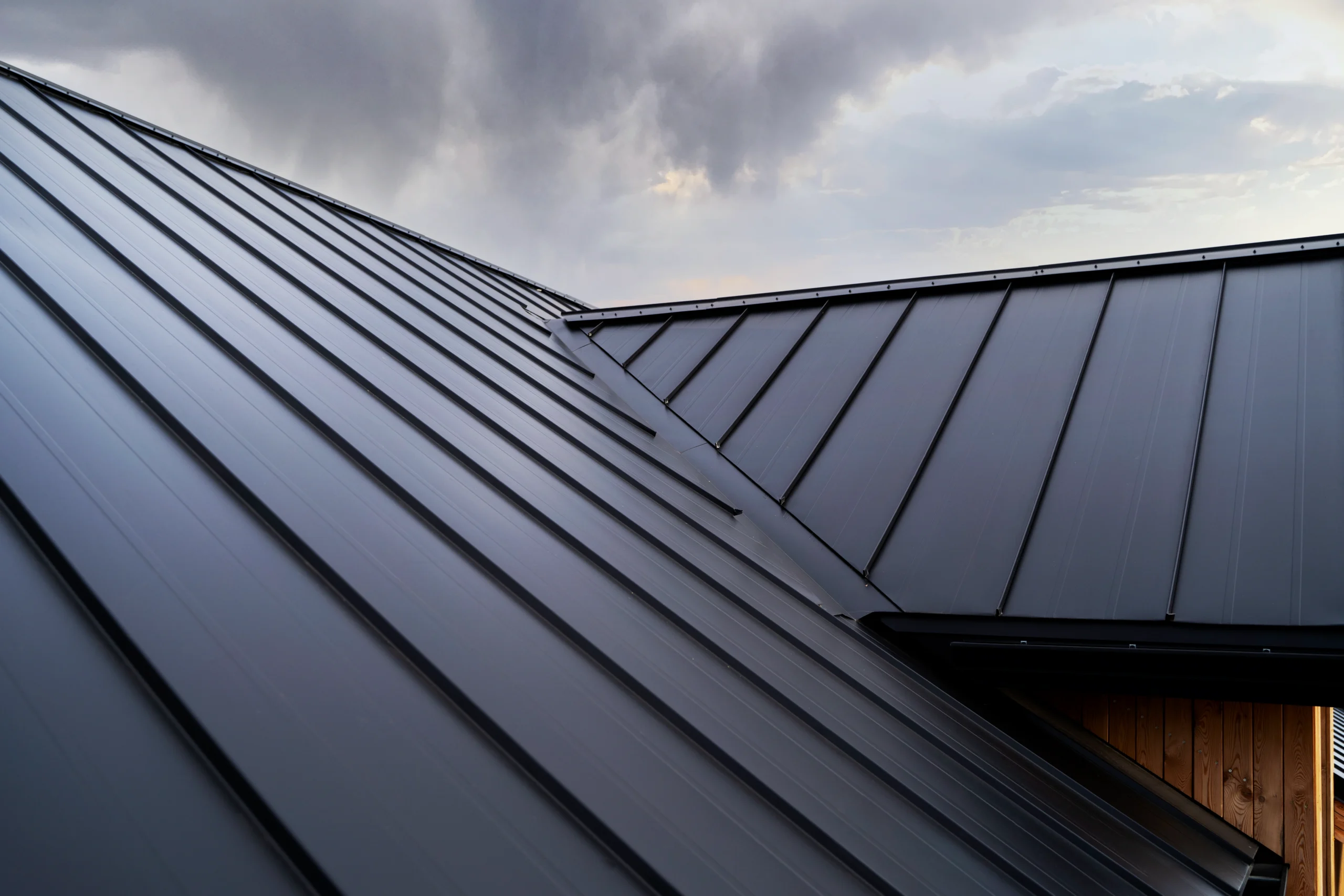 Dark standing seam metal roof installed by a professional Commercial Exterior Contractor.
