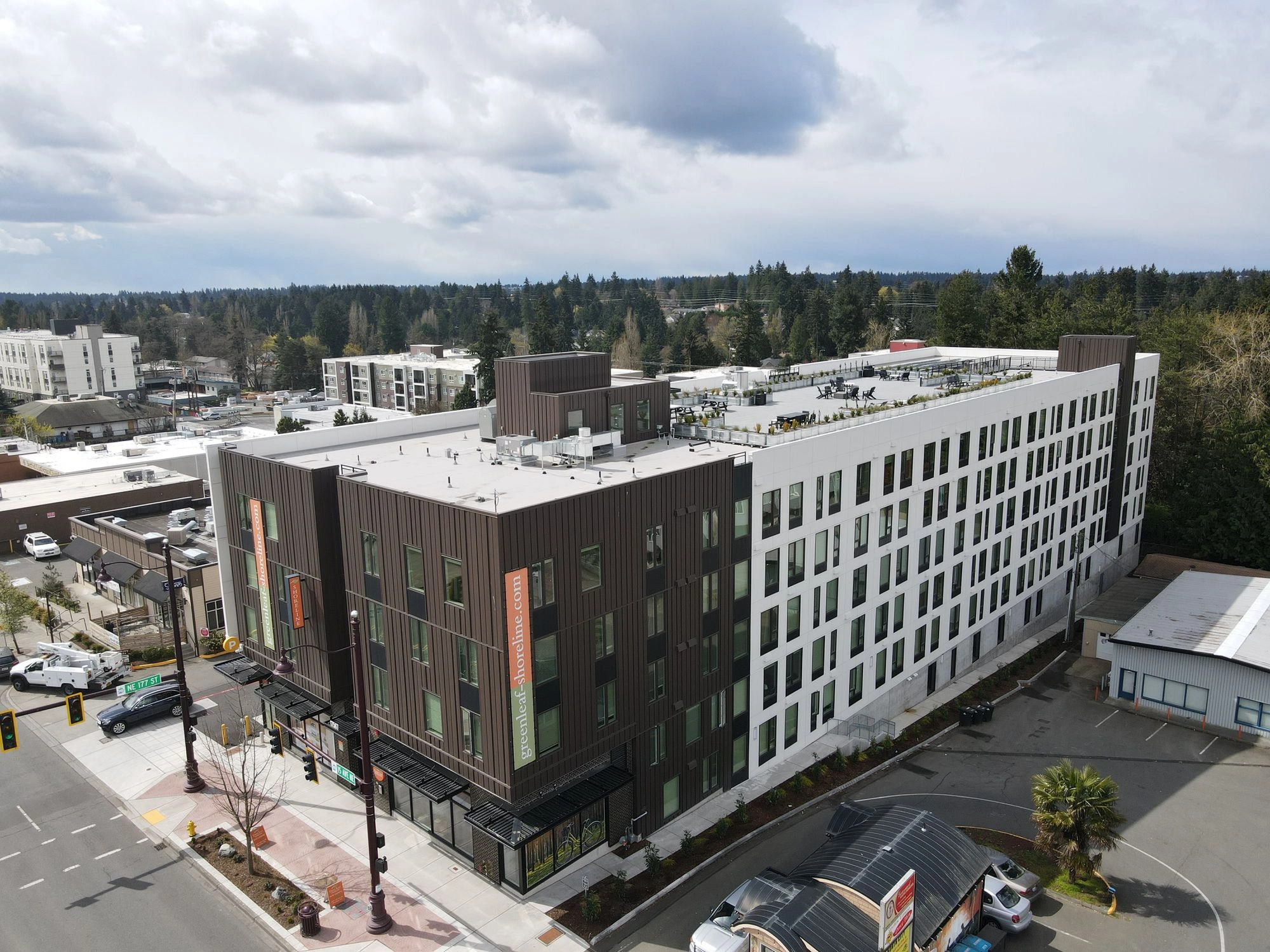 Aerial view of a modern multi-story apartment building updated by a professional Commercial Exterior Contractor Shoreline.